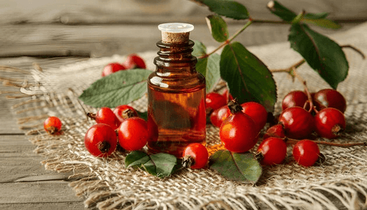 Discover The More Best Natural Ingredients in Cosmetics, showcasing a bottle of natural oil and red berries.