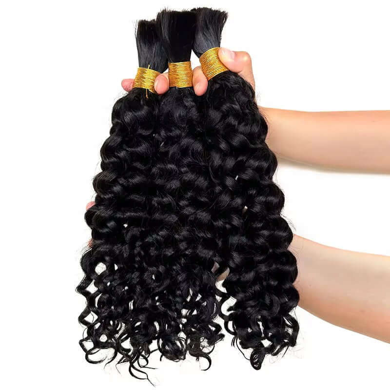 100% Natural Bulk Hair bundles with soft waves held in hand, showcasing the natural texture and quality.